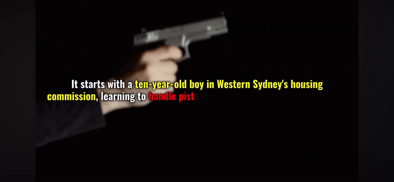 Young Modi Tajour handling a pistol at age ten