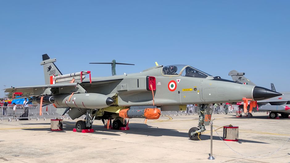 Indian Air Force Jaguar on display at the Bengaluru airshow with clear blue skies.
