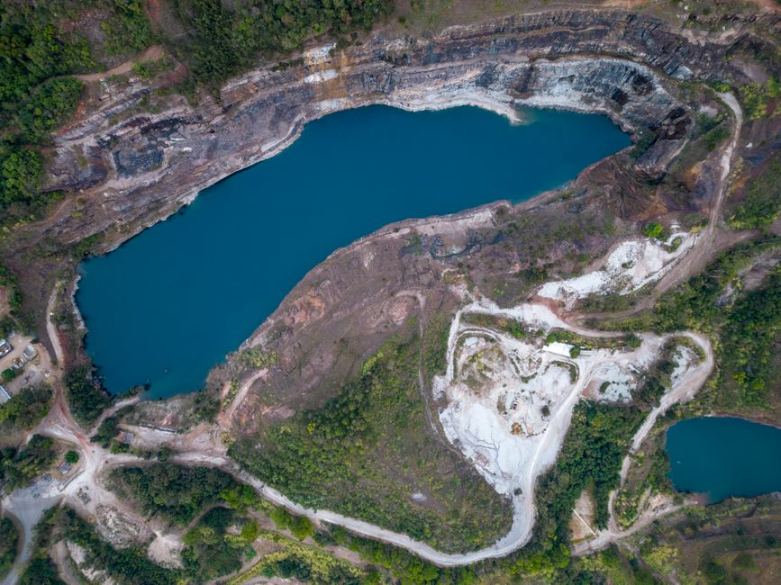 Stunning aerial view of a quarry and blue lake in Belo Horizonte, Brazil.